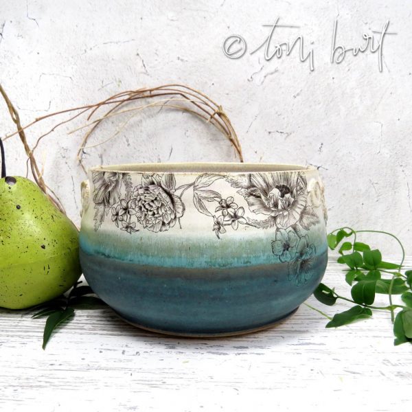 handmade teal and floral ceramic bowl
