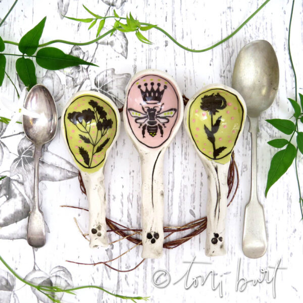 handmade ceramic spoons with bee and wildflowers