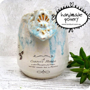 handmade ceramic organic pitcher with botanical imagery and gold detail toni burt