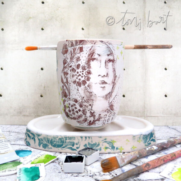handmade artist ceramic palette and water jar with girl and floral imagery